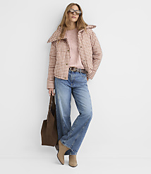 A woman in a pink plaid jacket and jeans stands against a plain white background, holding a brown tote bag. carousel Product Image 2