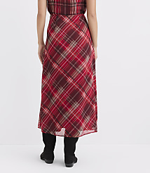 A person wearing a red plaid skirt and black boots stands against a plain white background. carousel Product Image 3