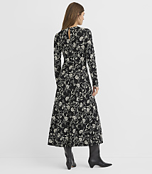 A woman in a black floral dress and black boots stands against a plain white background. carousel Product Image 3