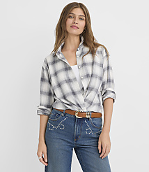 A woman in a plaid shirt and jeans stands against a plain white background. carousel Product Image 2
