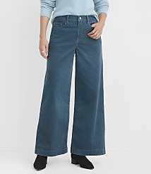 A person stands in the foreground wearing teal corduroy wide-leg pants and black boots, with a plain white background. carousel Product Image 2