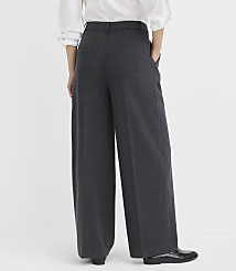 A person wearing wide-leg gray trousers and a white shirt stands against a plain white background. carousel Product Image 3