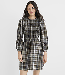 A woman in a plaid dress stands against a plain white background. carousel Product Image 2