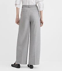 A person wearing wide-leg gray pants and black loafers stands against a plain white background. carousel Product Image 3