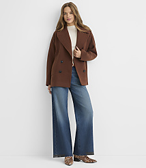 A woman in a brown peacoat and wide-leg jeans stands against a plain white background. carousel Product Image 1