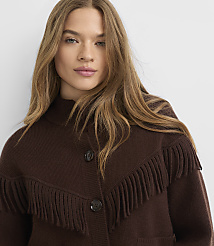 A woman with long, blonde hair wears a brown fringed cardigan against a plain white background. carousel Product Image 4