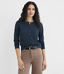 A woman in a teal cardigan and brown pants stands against a plain white background. carousel Product Image 1