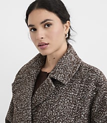 A woman in a textured brown coat with a white flecked pattern looks forward against a plain white background. carousel Product Image 4