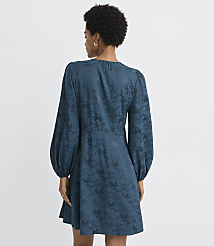 A woman in a teal jacquard dress with voluminous sleeves stands against a plain gray background. carousel Product Image 3