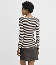 A woman in a striped long-sleeved shirt and a dark skirt stands against a plain, light gray background. carousel Product Image 3