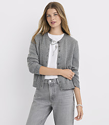 A woman in a gray cardigan and jeans stands against a plain white background. carousel Product Image 1