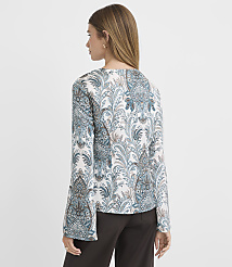 A woman in a patterned jacket stands against a plain background. carousel Product Image 3