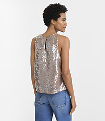 A woman in a sequined top and jeans stands against a plain white background. carousel Product Image 3