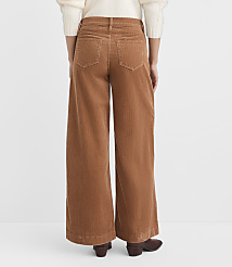 A person wearing wide-leg corduroy pants stands against a plain white background. carousel Product Image 3