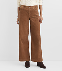 A person wearing brown corduroy pants and a cream sweater stands against a plain white background. carousel Product Image 2