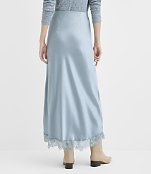 A person wearing a light blue satin skirt with lace trim stands against a plain, light gray background. carousel Product Image 3