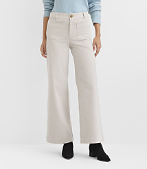 A person wearing light-colored wide-leg pants and black boots stands against a plain white background. carousel Product Image 2