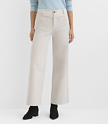 A person wearing light-colored wide-leg pants and black boots stands against a plain white background. carousel Product Image 1