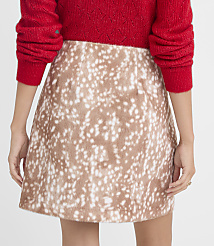 A person wearing a fuzzy red sweater and a fawn-spotted mini skirt stands against a plain background. carousel Product Image 4