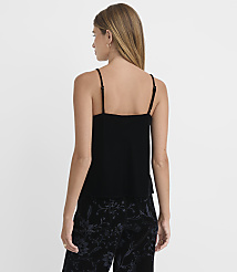 A woman in a black camisole and patterned pants stands against a plain white background. carousel Product Image 3