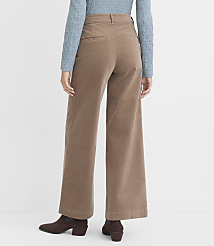 A person wearing wide-leg corduroy pants and brown boots stands against a plain white background. carousel Product Image 3