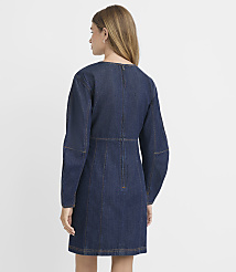 A woman in a dark denim dress stands against a plain white background. carousel Product Image 4