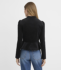 A woman in a black peplum jacket and blue jeans stands against a plain gray background. carousel Product Image 3