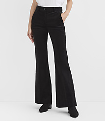 A person wearing black wide-leg trousers and black boots stands against a plain white background. carousel Product Image 2