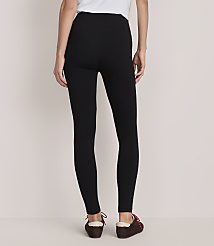 A person wearing black leggings and brown shoes stands against a plain, light-colored background. carousel Product Image 3