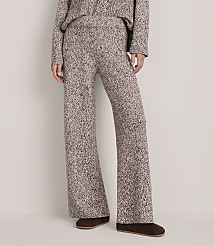 A person wears a matching brown and white textured knit set with brown loafers against a plain white background. carousel Product Image 2