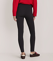 A person wearing a red sweater, black leggings, and brown shoes stands against a plain, light-colored background. carousel Product Image 3