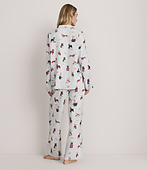 A woman stands with her back to the camera wearing light grey pajamas with a dog print against a plain, light-colored background. carousel Product Image 3