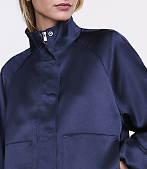 A person wearing a navy blue satin jacket stands against a plain white background. carousel Product Image 4