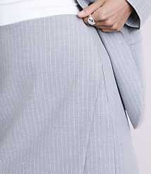A person wearing a grey pinstriped suit and a silver ring stands against a plain white background. carousel Product Image 4