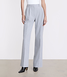 A person wears light blue pinstriped trousers and black boots against a plain white background. carousel Product Image 2