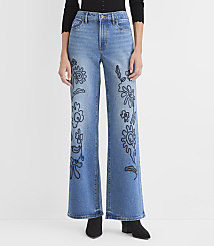 A person wears blue wide-leg jeans with black floral embroidery against a plain white background. carousel Product Image 2