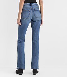 A person wearing blue jeans and black boots stands against a plain white background. carousel Product Image 2