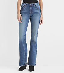 A person wearing blue flared jeans and black boots stands against a plain white background. carousel Product Image 2