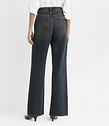 A person wearing a white shirt and wide-leg dark blue jeans stands against a plain white background. carousel Product Image 3