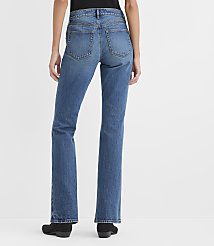 A person wearing blue jeans and black shoes stands against a plain white background. carousel Product Image 3