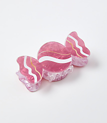 A pink candy-shaped accessory rests on a plain white background. carousel Product Image 1