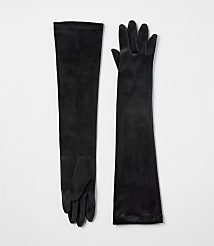 A pair of long black velvet gloves lies flat against a plain white background. carousel Product Image 1