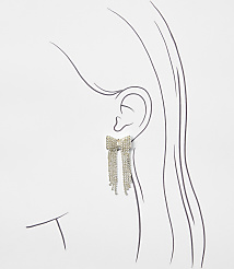 A sparkling bow-shaped earring with dangling crystal fringes is positioned against a minimalist line drawing of a woman's profile on a plain white background. carousel Product Image 2