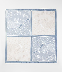 A square floral scarf with a blue and beige checkered pattern lies flat against a plain white background. carousel Product Image 2