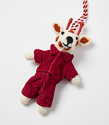 A small, spotted felt deer wearing a red corduroy outfit lies against a plain white background. carousel Product Image 2