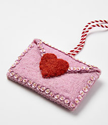 A pink felt envelope with a red heart and sequins sits on a plain white background. carousel Product Image 2