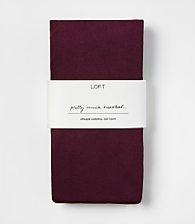 A pair of folded burgundy opaque control top tights with a white LOFT brand label centered against a plain white background. carousel Product Image 1