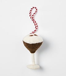 A felt ornament shaped like a cocktail glass with a brown drink and white foam sits against a plain white background. carousel Product Image 1