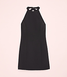 A black halter-neck dress is centered against a solid light pink background. carousel Product Image 4
