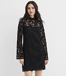 A woman wearing a black lace long-sleeved mini dress stands against a plain white background. carousel Product Image 1